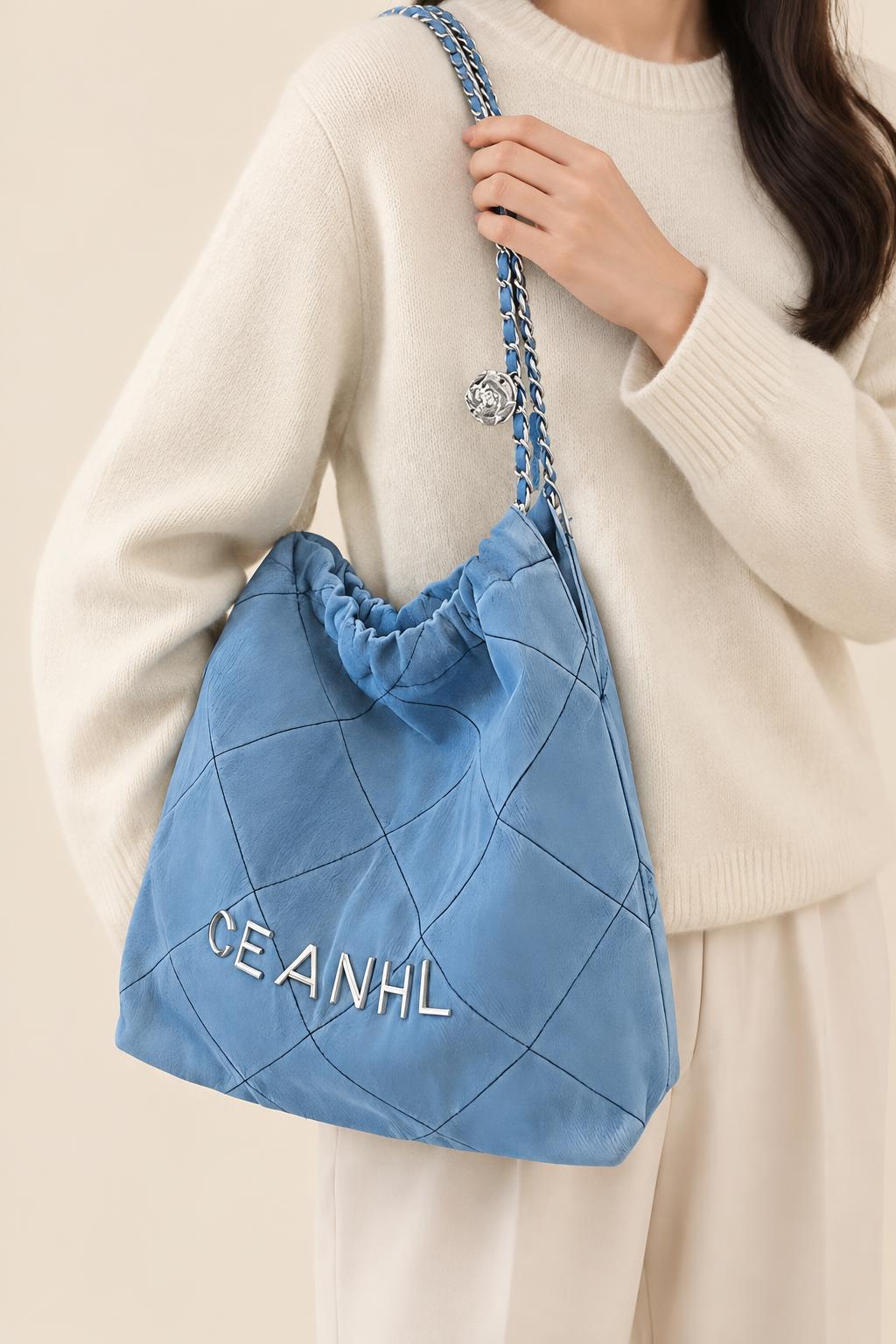 Quilted Denim-Style Bucket Shoulder Bag — carrying view